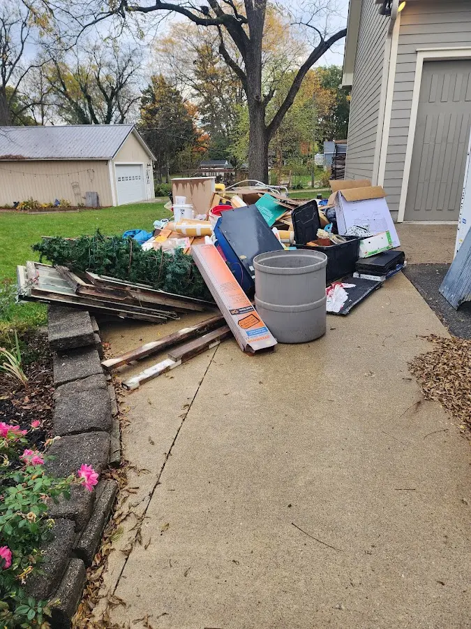 Dumpster being loaded with debris for Estate Cleanout Dumpster Rental in Danville